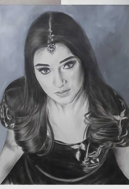 The finished mixed-media portrait of a woman with long dark hair